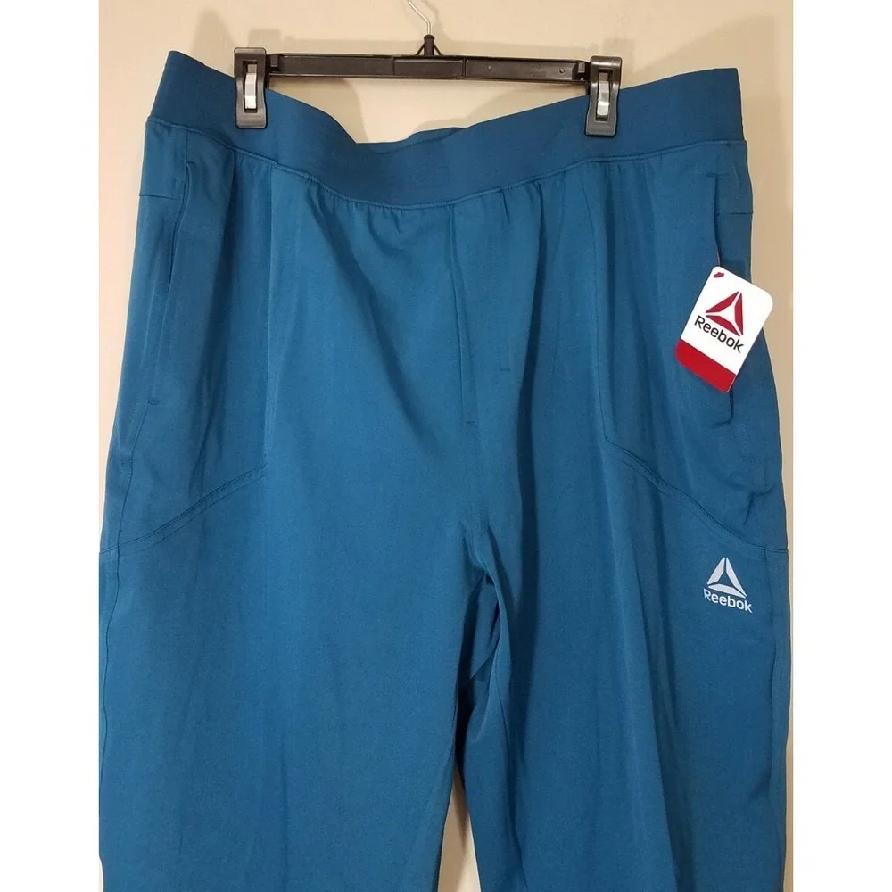 Reebok Distance Woven Jogger Pants Men 2XL Athletic Blue Coral Teal‎ Pockets NEW